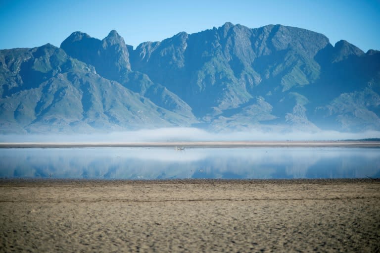 File picture taken May 10, 2017 shows bare sand and a narrow body of water at Theewaterskloof Dam, which has less than 20 percent of capacity, near Villiersdorp, about 100 kms from Cape Town