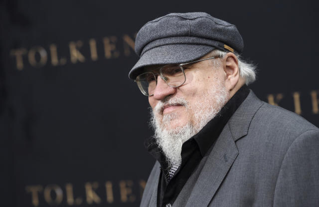 FILE - In this May 8, 2019, file photo, author George R.R. Martin poses at the premiere of the film &quot;Tolkien,&quot; at the Regency Village Theatre in Los Angeles. The &quot;Game of Thrones&quot; author won't be able to build a seven-sided, castle-style library at his compound in Santa Fe, N.M. The Santa Fe New Mexican reports that the city's Historic Districts Review Board denied a request Tuesday, Sept. 8, 2020, to allow Martin to exceed the building height limit in the historic district where he lives. (Photo by Chris Pizzello/Invision/AP, File)