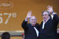 Actor Gerard Depardieu (R) and FIFA President Sepp Blatter pose on the red carpet for the screening of the film "United Passions" at the 67th Cannes Film Festival in Cannes May 18, 2014. REUTERS/Yves Herman (FRANCE - Tags: ENTERTAINMENT)