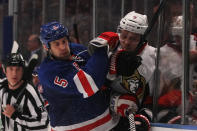 NEW YORK, NY - APRIL 26: Dan Girardi #5 of the New York Rangers checks Milan Michalek #9 of the Ottawa Senators in the third period of Game Seven of the Eastern Conference Quarterfinals during the 2012 NHL Stanley Cup Playoffs at Madison Square Garden on April 26, 2012 in New York City. (Photo by Bruce Bennett/Getty Images)