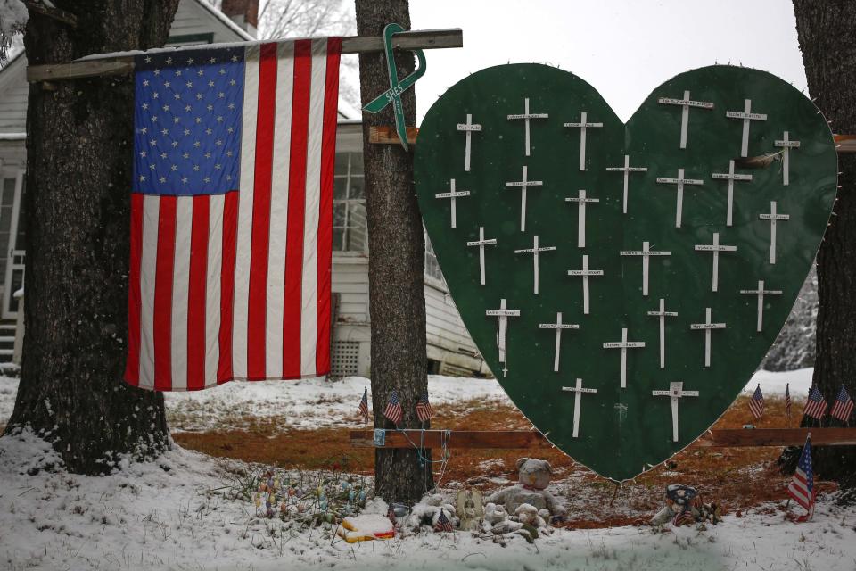 A memorial honoring the victims killed in the Sandy Hook Elementary School shooting is seen outside a home in Sandy Hook, Connecticut December 10, 2013. The Connecticut town of Newtown on Monday asked for privacy and a restrained media presence ahead of the anniversary of the shooting that killed 20 children and six adults at Sandy Hook Elementary School. REUTERS/Shannon Stapleton (UNITED STATES - Tags: CRIME LAW ANNIVERSARY)