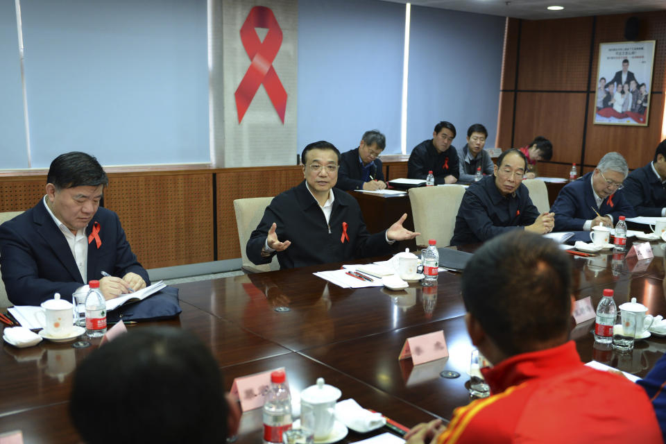 FILE- In this file photo released by China's Xinhua News Agency, then Chinese Vice Premier Li Keqiang, center, speaks at a symposium attended by representatives of HIV/AIDS related non-governmental organizations and international organizations in Beijing, Nov. 26, 2012. For most of his career, Li was known as a cautious, capable, and highly intelligent bureaucrat who rose through, and was bound by, a consensus-oriented Communist Party that reflexively stifles dissent. (Ma Zhancheng/Xinhua via AP, File)
