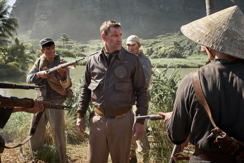 This image released by Lionsgate shows Aaron Eckhart as Lt. Commander Jimmy Doolittle in a scene from "Midway," in theaters on Nov. 8. (Alan Markfield/Lionsgate via AP)