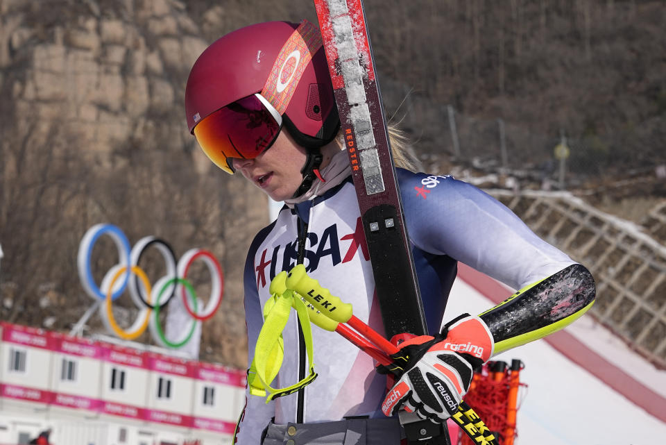 Mikaela Shiffrin of the United States walks from the finish area after a training run at the 2022 Winter Olympics, Thursday, Feb. 10, 2022, in the Yanqing district of Beijing. Two-time Olympic champion and pre-games medal favorite, Mikaela Shiffrin has skied out in the first run of both the slalom and giant slalom. (AP Photo/Luca Bruno)