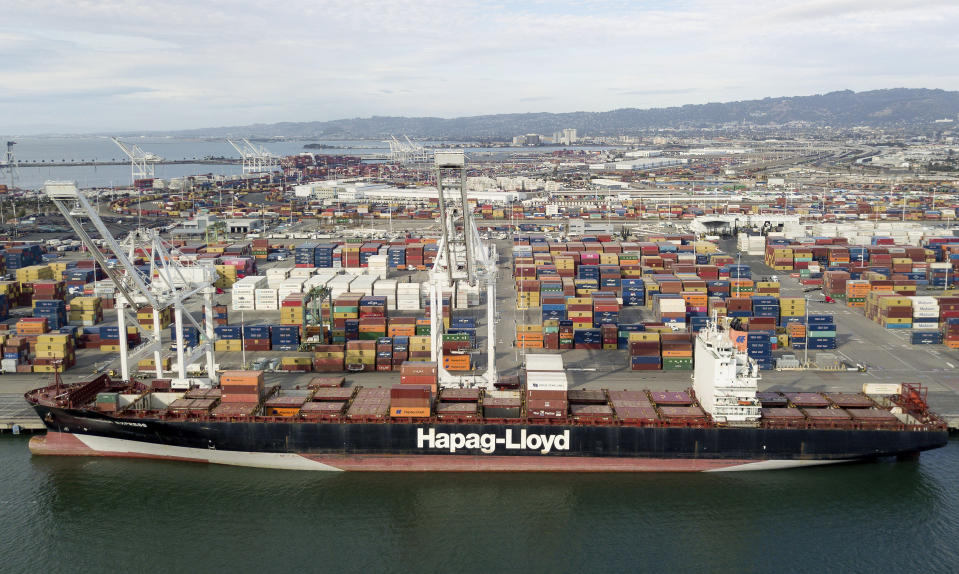 The Rotterdam Express is seen at the Port of Oakland, Wednesday, Oct. 6, 2021 in Oakland, Calif. The Rotterdam Express, a massive cargo ship made a series of unusual movements while anchored in the closest spot to a Southern California oil pipeline that ruptured and sent crude washing up on beaches, according to data collected by a marine navigation service. (AP Photo/Josh Edelson)