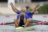 Yana Dementieva (front), Anastasiia Kozhenkova, Nataliya Dovgodko, and Kateryna Tarasenko of Ukraine celebrate after winning the women's quadruple sculls Final A at Eton Dorney during the London 2012 Olympic Games August 1, 2012. REUTERS/Natacha Pisarenko/Pool (BRITAIN)