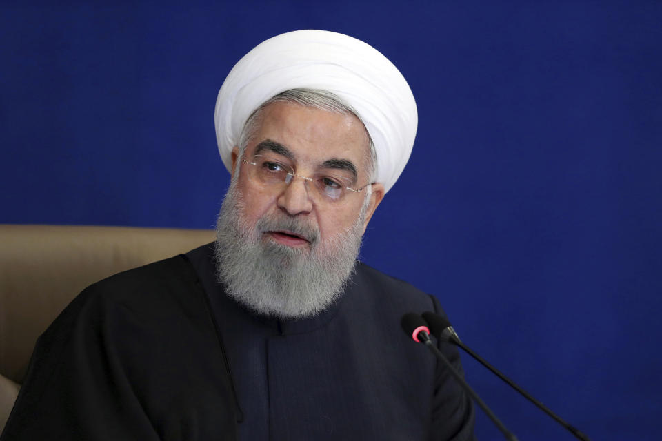 In this photo released by the official website of the office of the Iranian Presidency, President Hassan Rouhani speaks in a meeting in Tehran, Iran, Wednesday, Dec. 9, 2020. Rouhani said Wednesday that U.S. sanctions are making it difficult for Iran to purchase medicine and health supplies from abroad, including COVID-19 vaccines needed to contain the worst outbreak in the Middle East. (Iranian Presidency Office via AP)