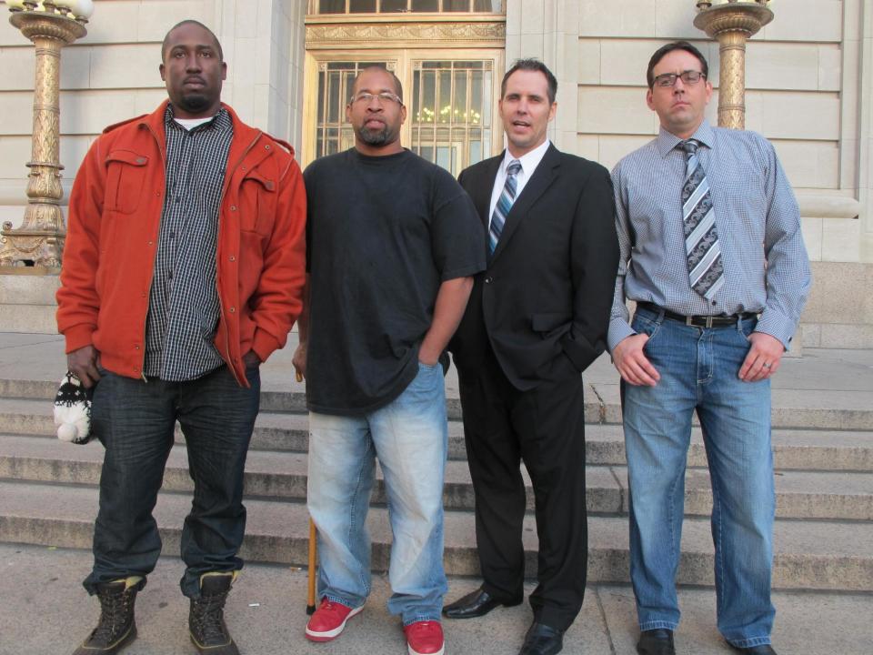 From left to right, Damon Robinson, 36, of Lexington, Ky., Mark Hedges, 45, of Cincinnati., Jim Lancaster, 46, of Alexandria, Ky., and Micah Morthland, 38, of Highland Heights, Ky., pose in front of the Hamilton County Court of Common Pleas, Monday, Nov. 5, 2012, in Cincinnati, shortly after filing a lawsuit against builders of Cincinnati's first and only casino, slated to open in the spring. The men were injured while pouring concrete on a second floor at the casino in January and allege that the construction firms neglected safety to get the project done on time. (AP Photo/Amanda Lee Myers)