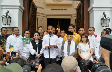 FILE PHOTO: Incumbent Indonesian president Joko Widodo talks to media about the result of a presidential election, during a press briefing in Jakarta, Indonesia, April 18, 2019. REUTERS/Angie Teo/File photo