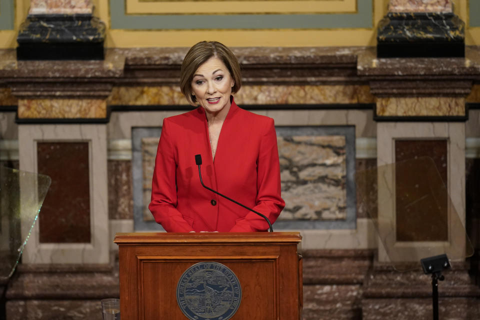 FILE - In this Jan. 12, 2021 file photo, Iowa Gov. Kim Reynolds delivers her Condition of the State address before a joint session of the Iowa Legislature at the Statehouse in Des Moines, Iowa. As Republicans march ahead with their campaign to tighten voting laws in political battlegrounds, some in their party are worried the restrictions will backfire by making it harder for GOP voters to cast ballots. The restrictions backed by Republicans in Iowa, Georgia, Florida, Texas and Arizona often take aim at mail voting, a method embraced by voters from both parties but particularly popular with older voters. (AP Photo/Charlie Neibergall, File)