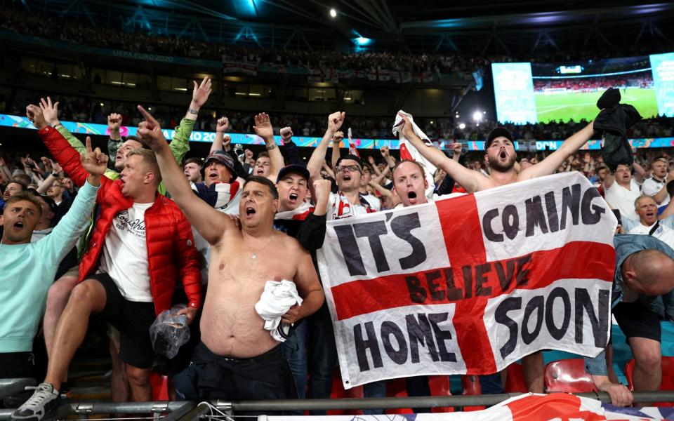 England fans celebrate at the Euro 2020 semi-final match against Denmark at Wembley Stadium on 7 July 2021 - Carl Recine/Pool via Reuters