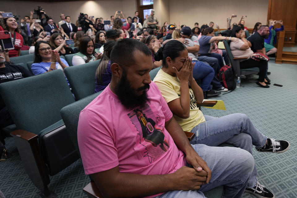 Family members of the victims of the Uvalde shootings react after a Texas House committee voted to take up a bill to limit the age for purchasing AR-15 style weapons in the full House in Austin, Texas, Monday, May 8, 2023. (AP Photo/Eric Gay)