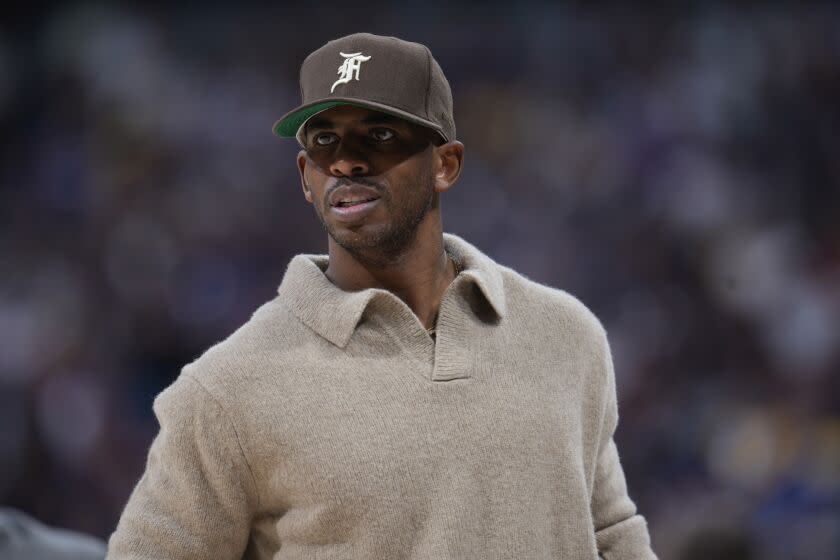 Injured Phoenix Suns guard Chris Paul (3) in the second half of Game 5 of an NBA Western Conference basketball semifinal playoff series Tuesday, May 9, 2023 in Denver.  (AP Photo/David Zalubowski)