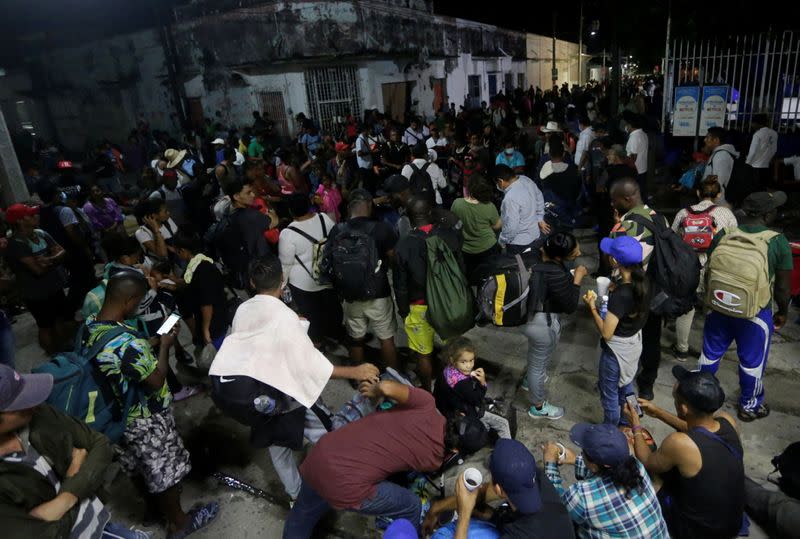 Migrants join a caravan heading to Mexico City, in Huixtla