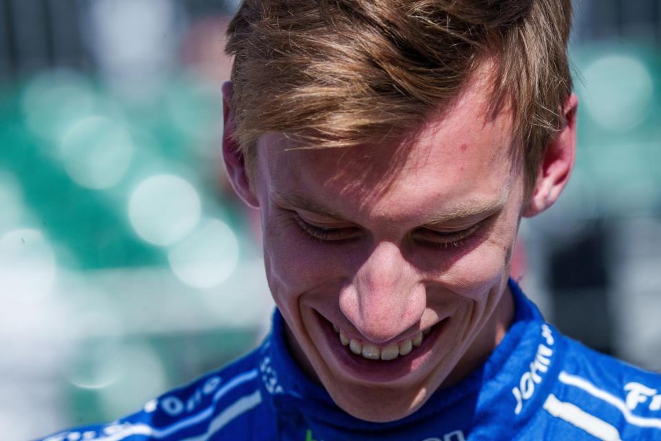 Dale Coyne Racing with Rick Ware Racing driver Sting Ray Robb (51) smiles Sunday, May 21, 2023, after earning a spot in the 107th running of the Indianapolis 500.