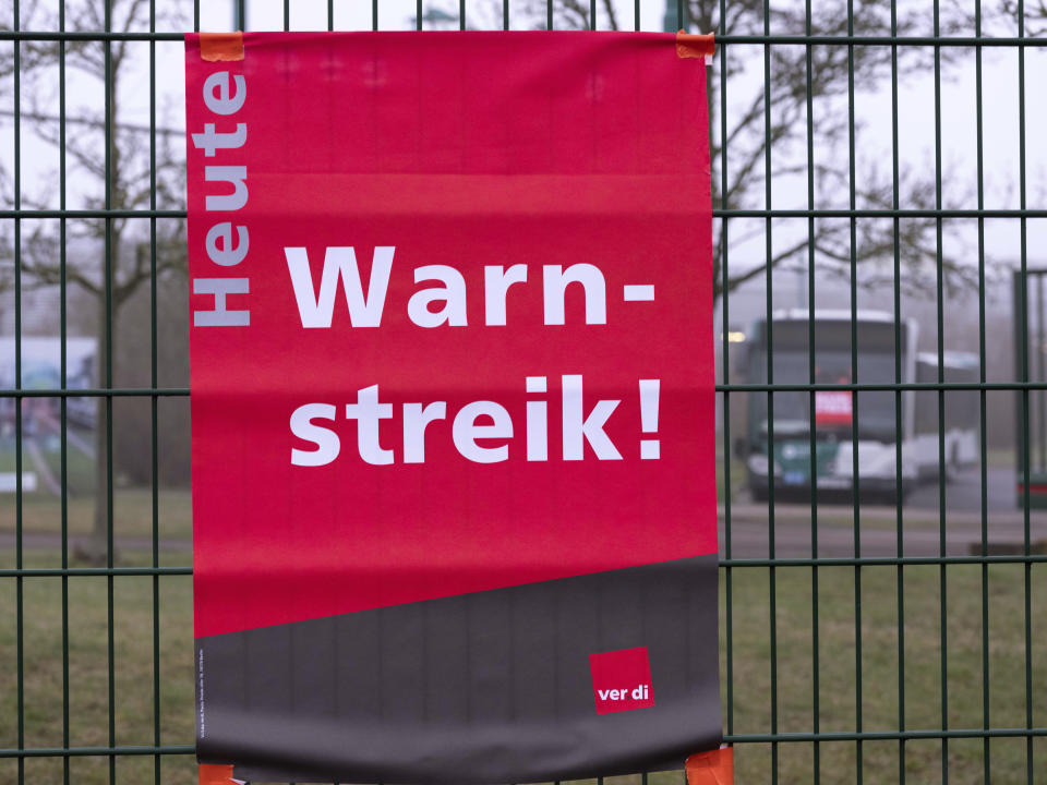 "Warning strike today" is written on posters at the entrance to the ViP depot (Verkehrsbetrieb Potsdam) in Potsdam, Germany, Friday March 1, 2024. Local buses, subway trains and trams ground to a halt in much of Germany Friday at the peak of a week of walkouts by employees demanding better working conditions. (Georg Moritz/dpa via AP)