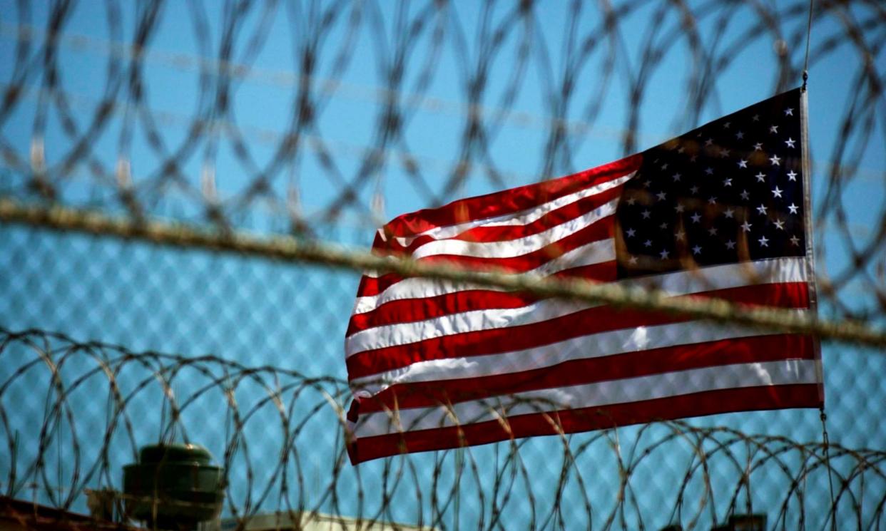 <span>An American flag flying at Guantánamo Bay.</span><span>Photograph: Mike Brown/EPA</span>