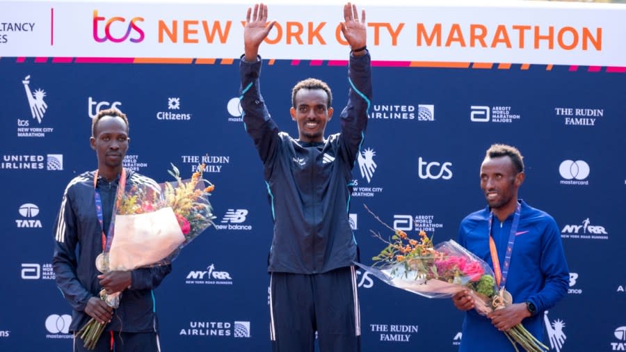 (From left) Second-place finisher Albert Korir of Kenya, first-place finisher Tamirat Tola of Ethiopia and third-place finisher Shura Kitata, also from Ethiopia, pose after the men’s division of the New York City Marathon Sunday in New York. (Photo: Craig Ruttle/AP)