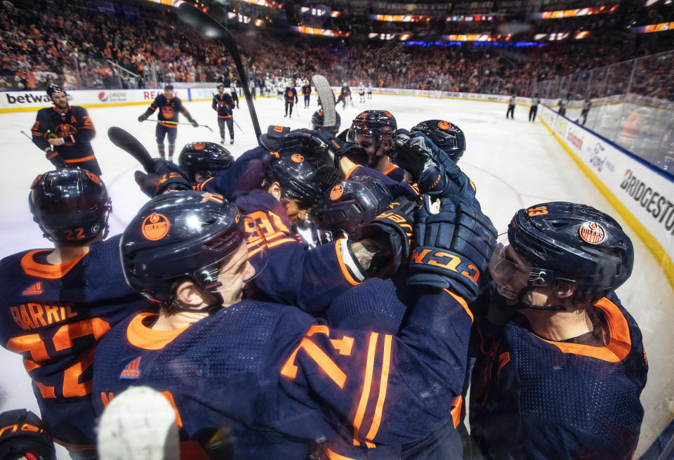 Edmonton Oilers celebrate a win over the San Jose Sharks during overtime NHL hockey game action in Edmonton, Alberts, Thursday, April 28, 2022. (Jason Franson/The Canadian Press via AP)