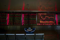 A Chinese investor monitors stock prices at a brokerage house in Beijing, Wednesday, Oct. 23, 2019. Asian stock markets followed Wall Street lower Wednesday after major companies reported mixed earnings and an EU leader said he would recommend the trade bloc allow Britain to delay its departure. (AP Photo/Andy Wong)