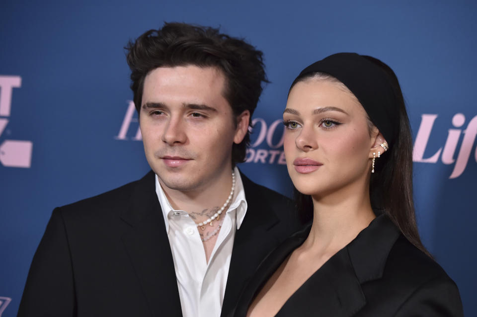 Nicola Peltz Beckham, right, and Brooklyn Peltz Beckham arrive at The Hollywood Reporter's Women in Entertainment Gala on Wednesday, Dec. 7, 2022, at Fairmont Century Plaza in Los Angeles. (Photo by Jordan Strauss/Invision/AP)