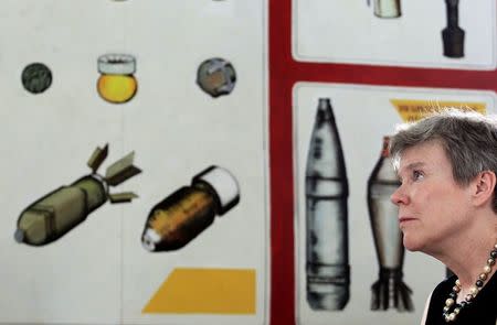 U.S. Under Secretary of State for Arms Control and International Security Rose Gottemoeller looks on in front of images of U.S. bombs, mines and mortars during her visit to a bombs and mines education centre in Vietnam's central Quang Tri province, in this March 2, 2015 file photo. REUTERS/Kham/Files