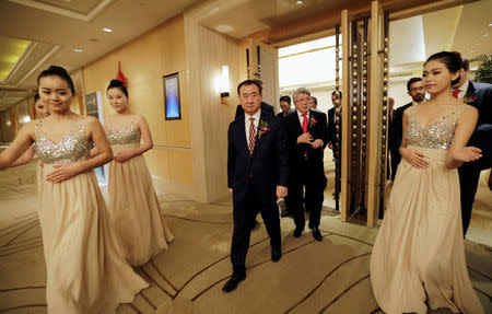 FILE PHOTO: Wang Jianlin (L), chairman of Dalian Wanda Group, and Atletico Madrid's President Enrique Cerezo arrive for a signing ceremony in Beijing, January 21, 2015. REUTERS/Jason Lee/File Photo