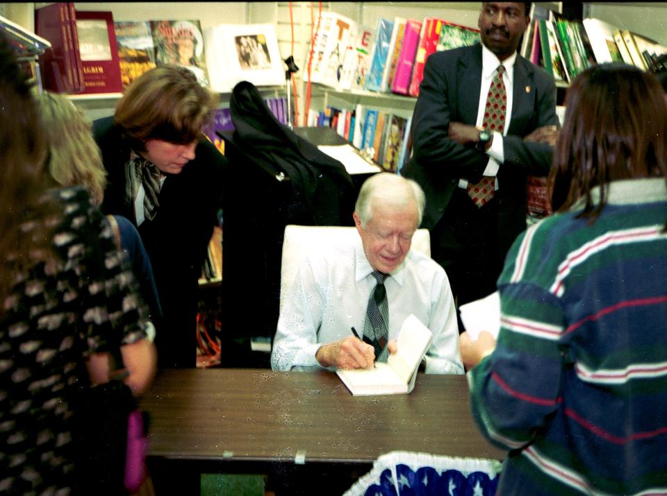 December 9, 1997 - Former President Jimmy Carter autographed his latest inspirational book, "Sources of Strength: Meditations on Scripture for a Living Faith," at the Vero Beach Book Center. Carter's book contained many of the Sunday school lessons he has taught at Maranatha Baptist Church in Plains, Ga. More than 2,500 people were on hand for the book signing.