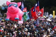 People join a protest to oppose the import of U.S. pork containing ractopamine, an additive that enhances leanness in Taipei