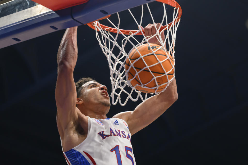 Kansas guard Kevin McCullar Jr. dunks against North Carolina Central during the first half of an NCAA college basketball game in Lawrence, Kan., Monday, Nov. 6, 2023. (AP Photo/Reed Hoffmann)