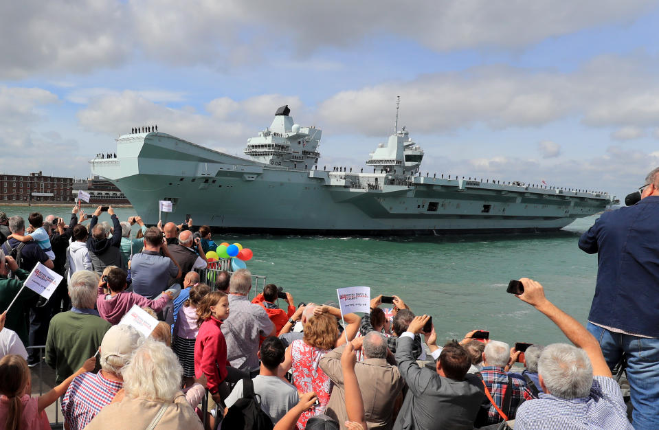 HMS Queen Elizabeth is waved off as she sets sail from Portsmouth Naval Base, for deployment to the United States. (Photo by Gareth Fuller/PA Images via Getty Images)