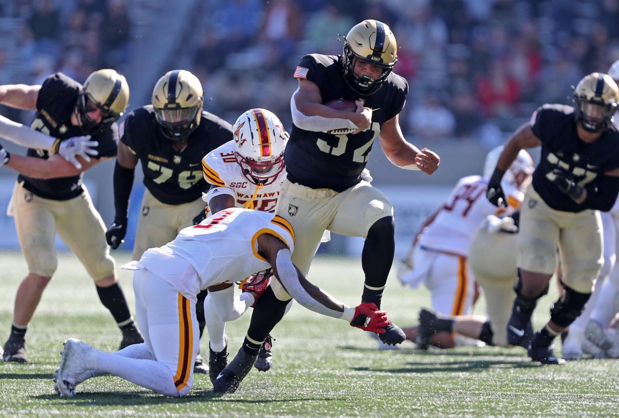 Oct 22, 2022; West Point, New York, USA; Army Black Knights running back Tyson Riley (32) carries the ball against the Louisiana Monroe Warhawks during the second half at Michie Stadium. Mandatory Credit: Danny Wild-USA TODAY Sports