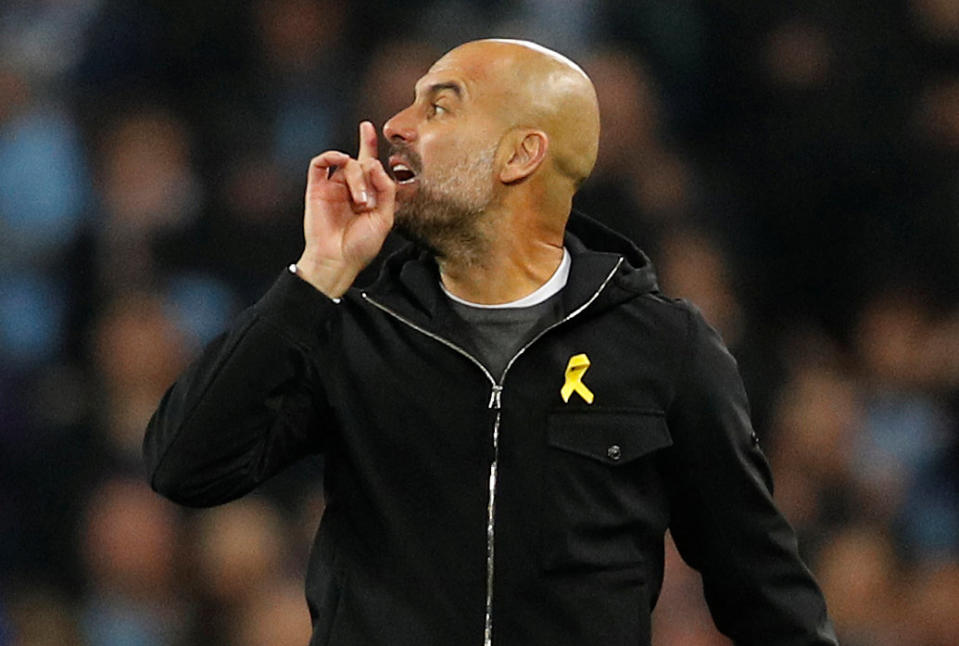 Pep Guardiola gestures toward the referee after being sent off at halftime of Manchester City’s Champions League quarterfinal second leg against Liverpool. (Reuters)