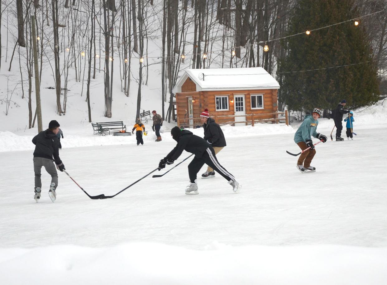 Young hockey players practice on the ice at the Charlevoix ice rink near Mt. McSauba.