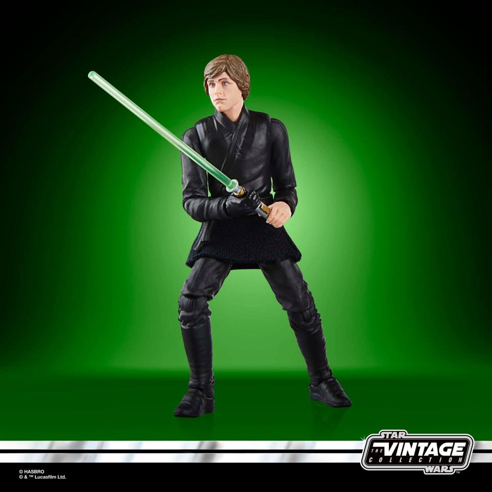 Star Wars Luke and Grogu action figures posed against a green background