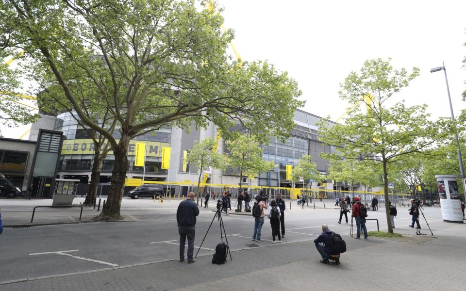 Television crews and media are seen outside the Signal Iduna Park Stadium - GETTY IMAGES