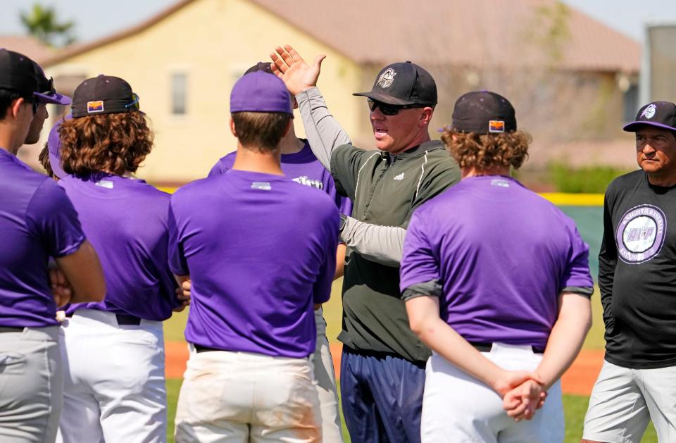 Arizona College Prep baseball head coach Andrew Pollak huddles with his players during practice at Arizona College Prep in Chandler on April 19, 2023.