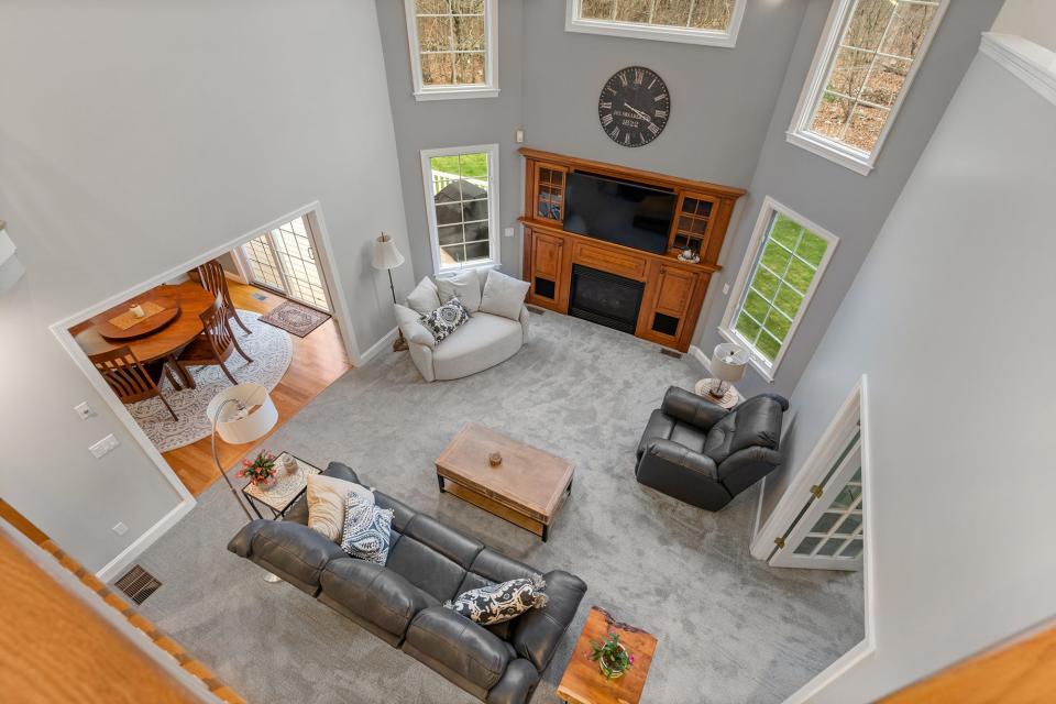 The centerpiece of the first floor is a two-story family room, which is open to a second-floor balcony.