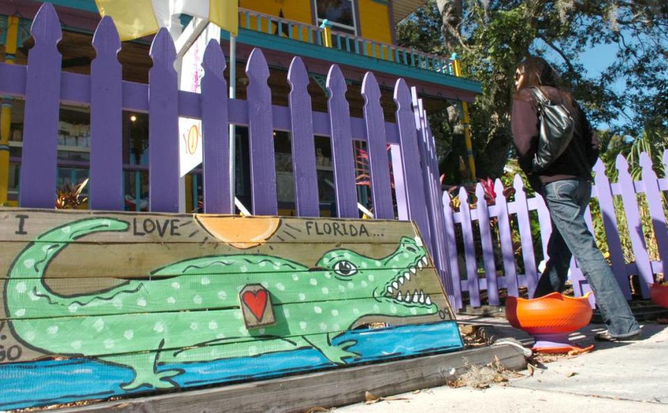 A painted alligator greets visitors to the Inner Visions art gallery, during the Village of the Arts Holiday ArtWalk in 2010. 