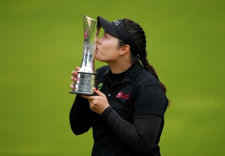 Britain Golf - RICOH Women's British Open 2016 - Woburn Golf & Country Club, England - 31/7/16 Thailand's Ariya Jutanugarn celebrates with the trophy after winning the Women's British Open 2016 Action Images via Reuters / Andrew Couldridge Livepic