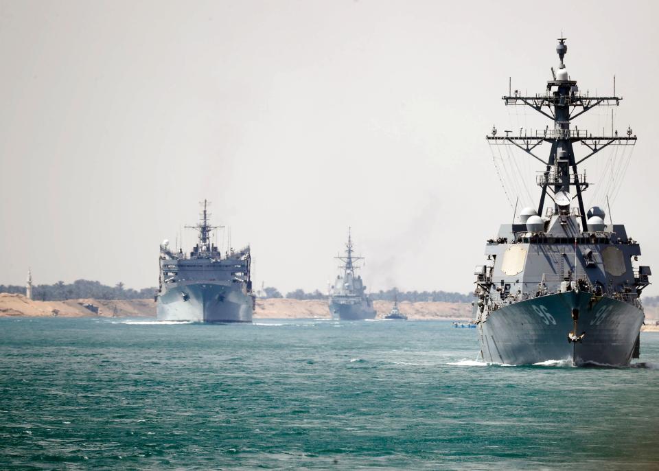 In this May 9, 2019, photo released by the US Navy, the Abraham Lincoln Carrier Strike Group  transits the Suez Canal. The carrier group passed through the Suez Canal, Egyptian authorities said, as the group heads towards the Gulf amid rising tensions between Washington and Tehran.