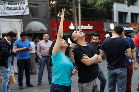 People react during a tremor in Mexico City, Mexico February 16, 2018. REUTERS/Carlos Jasso