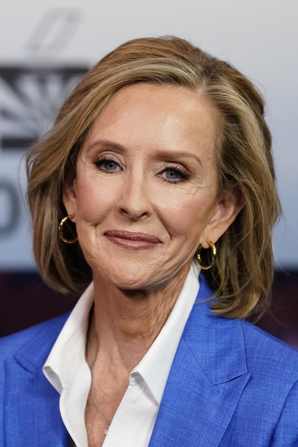 Karrin Taylor Robson, Republican candidate for Arizona governor, poses for a photograph prior to a PBS televised debate Wednesday, June 29, 2022, in Phoenix. (AP Photo/Ross D. Franklin)