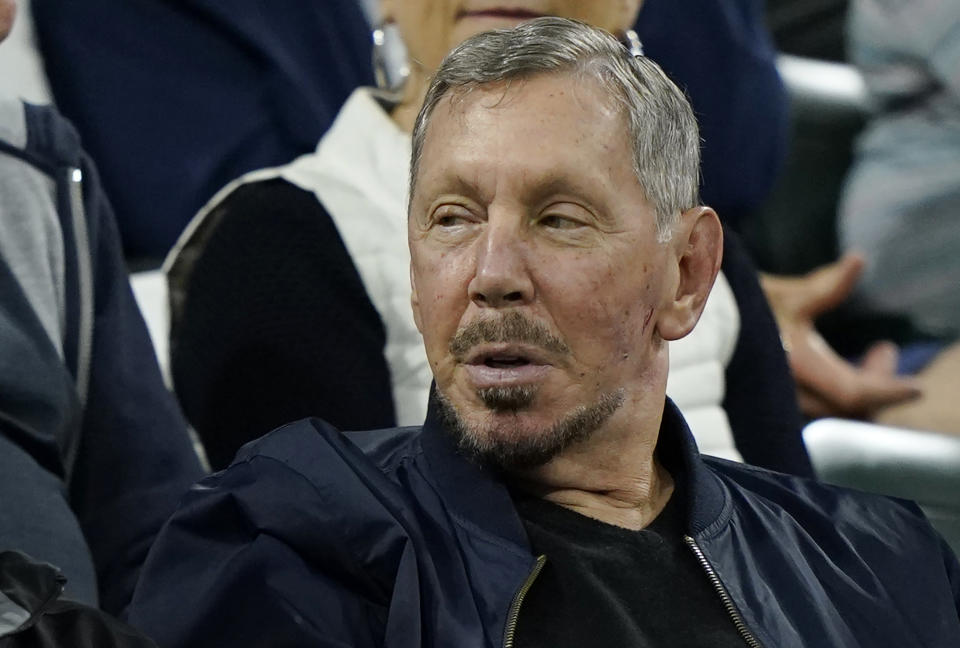 FILE - Larry Ellison, chairman of Oracle Corporation and chief technology officer, watches from the stands at the BNP Paribas Open tennis tournament Oct. 13, 2021, in Indian Wells, Calif. Oracle Corp.'s planned campus in Nashville, Tenn. will serve as the computer technology giant's world headquarters, placing it in a city that's a center of the health care industry, CEO Larry Ellison said. (AP Photo/Mark J. Terrill, File)