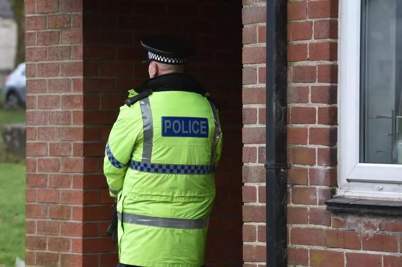 Forensics at the scene after the killing -Credit:Vincent Cole - Manchester Evening News