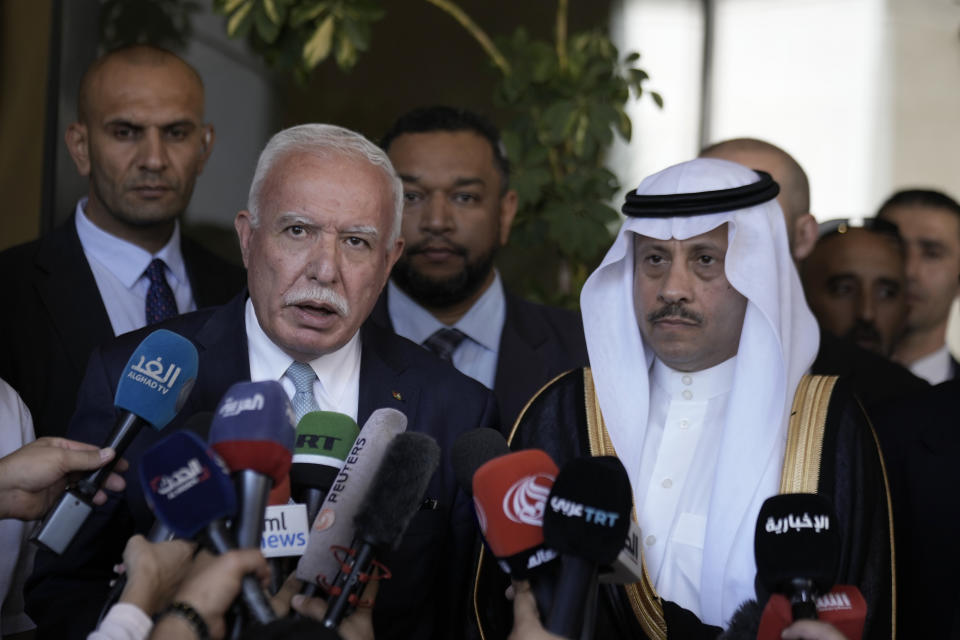 Nayef al-Sudairi, Saudi Arabia's the first-ever Saudi ambassador to the Palestinian Authority, right, and Palestinian Minister of Foreign Affairs and Expatriates, Dr. Riyad Al-Maliki, left, make a joint statement after their meeting in Ramallah, Tuesday, Sept. 26, 2023. Al-Sudairi visited the Palestinian territories Tuesday to discuss the burgeoning Saudi-Israeli normalization deal, which the kingdom has said will hinge on what concessions Israel is willing to grant the Palestinians. (AP Photo/Majdi Mohammed)