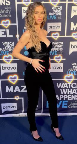 <p>BravoWWHL/Instagram</p> Lala Kent shows off baby bump in black jumpsuit for 'WWHL' appearance.