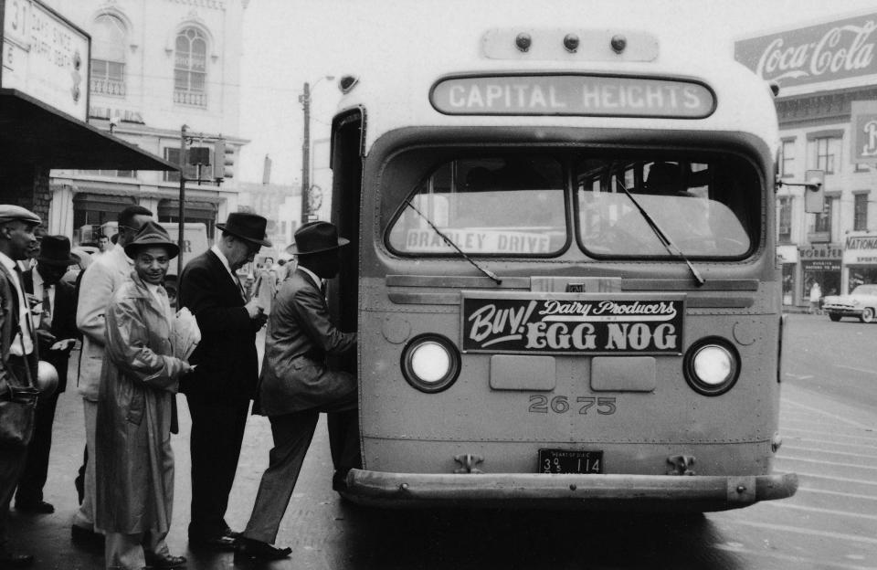 African Americans boarding bus at the end of a bus boycott in Montgomery, Alabama, that lasted more than a year.