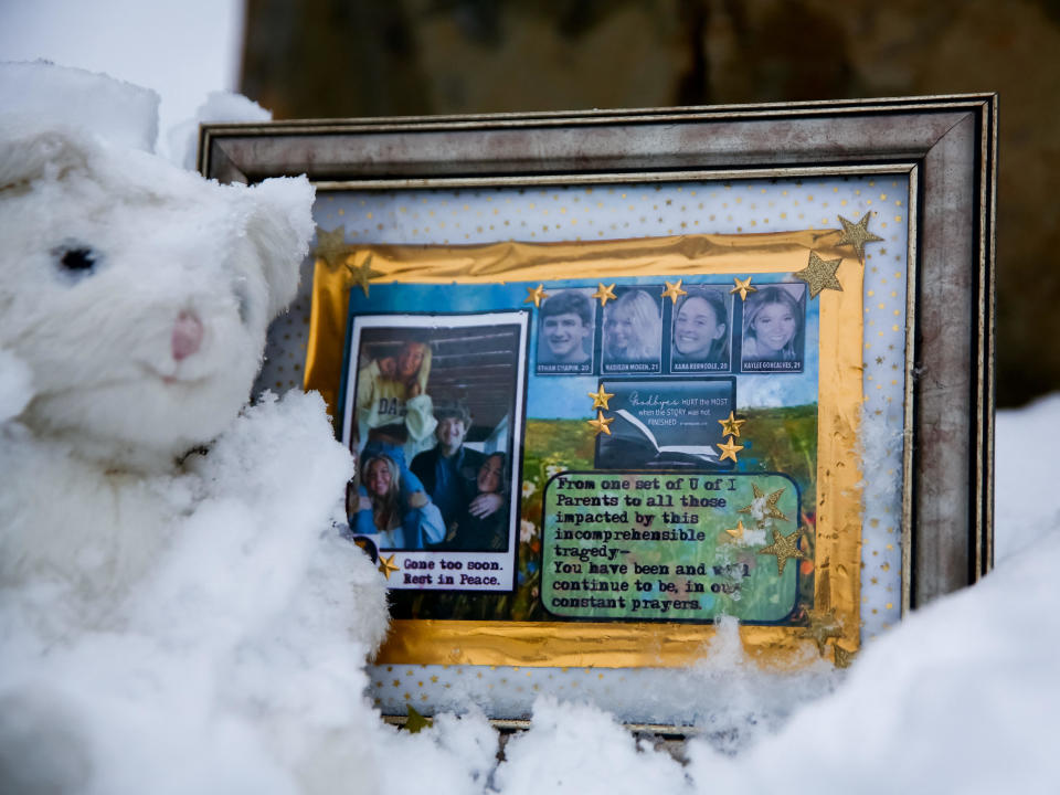 A small frame remembering Ethan Chapin, Madison Mogen, Xana Kernodle and Kaylee Goncalves sits in the snow outside of the residence where the four students were killed on November 13 in Moscow, Idaho, U.S., November 30, 2022. / Credit: LINDSEY WASSON / REUTERS