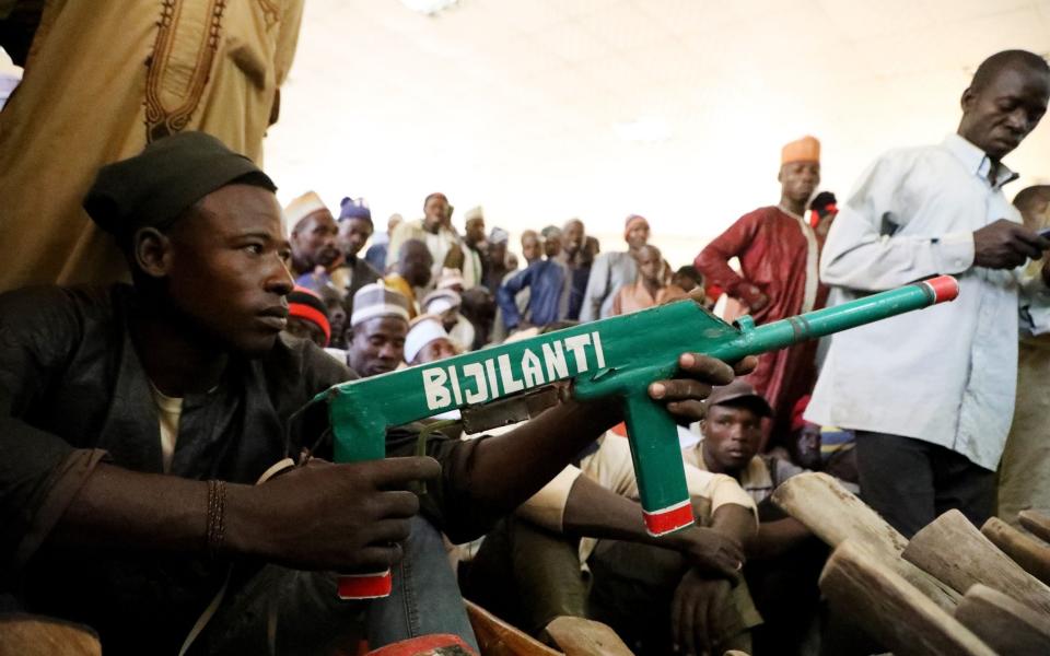 A member of the Yansakai vigilante group - KOLA SULAIMON /AFP